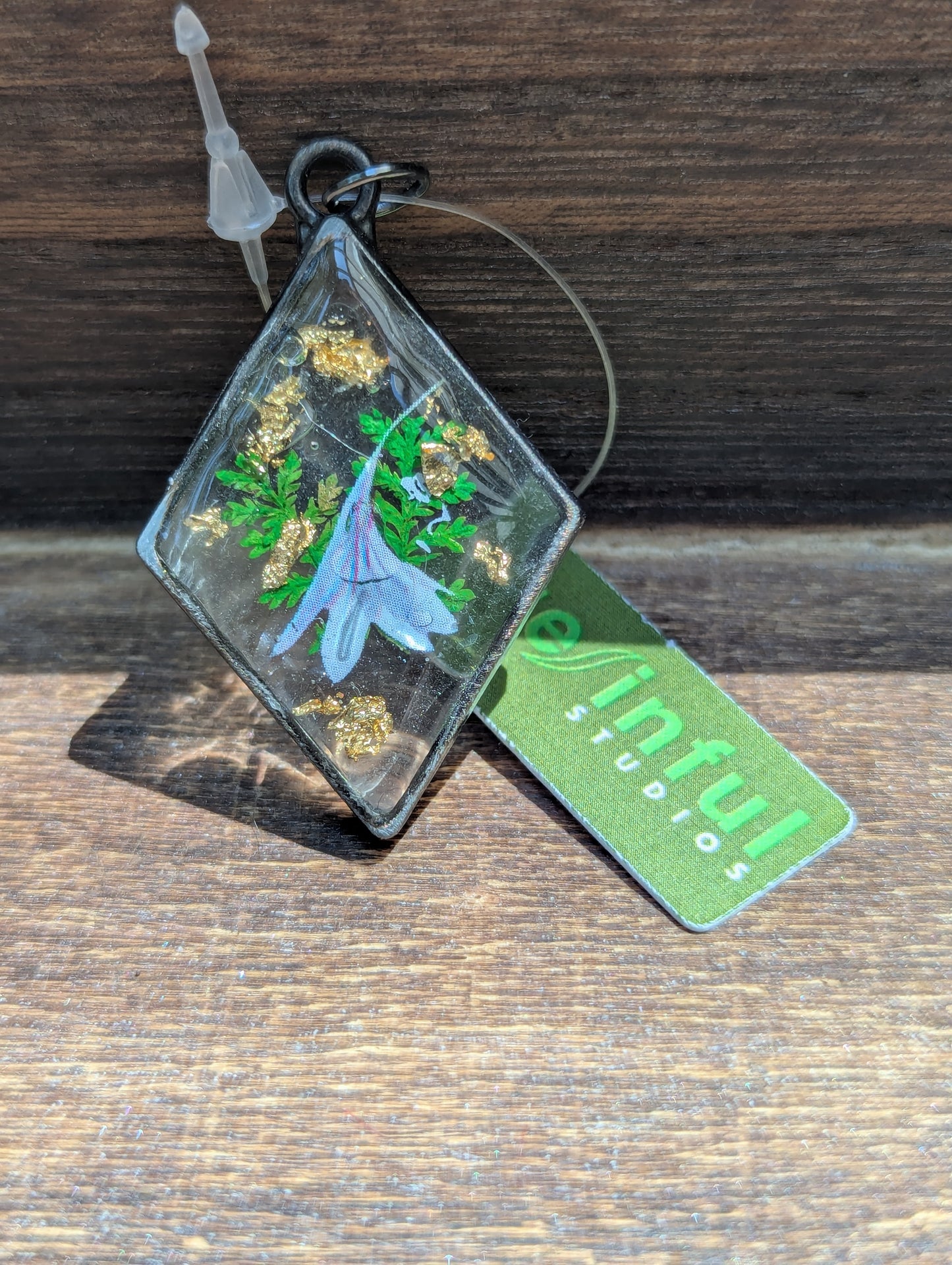 Floral inclusion pendants